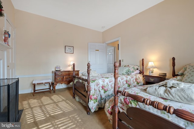 carpeted bedroom with vaulted ceiling