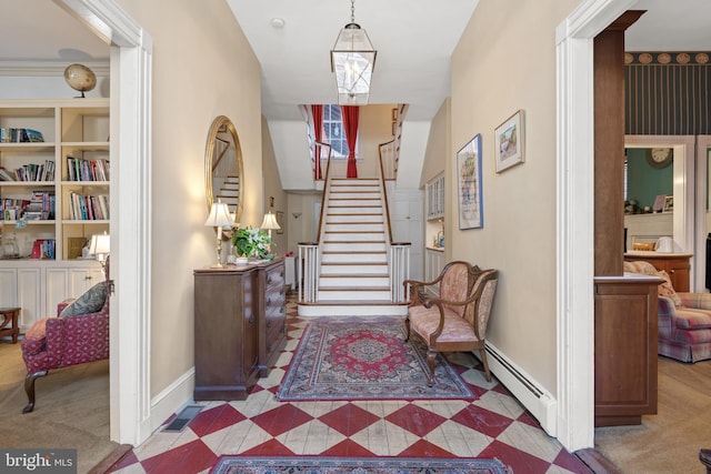 entryway featuring light carpet and a baseboard radiator