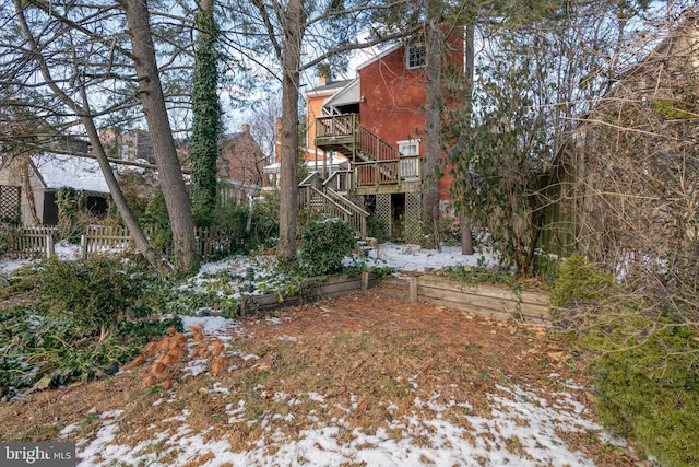 view of yard layered in snow