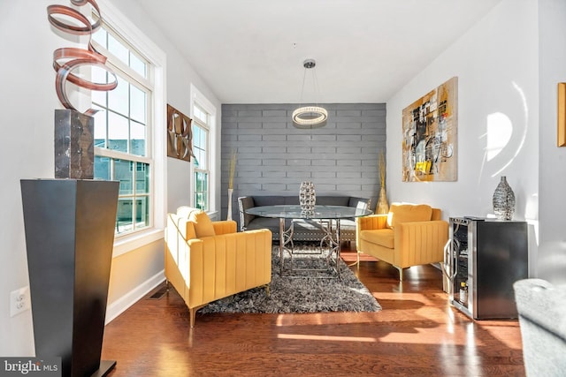 sitting room with hardwood / wood-style flooring