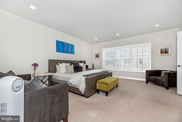 bedroom featuring light carpet