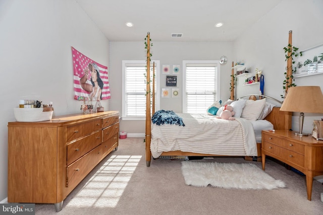 bedroom featuring light carpet