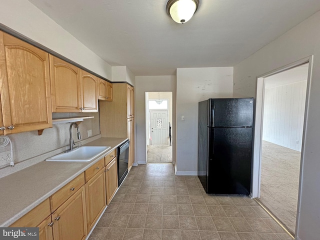 kitchen featuring sink and black appliances