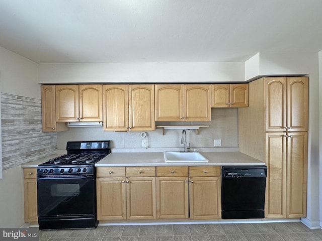 kitchen with sink, light brown cabinets, backsplash, and black appliances