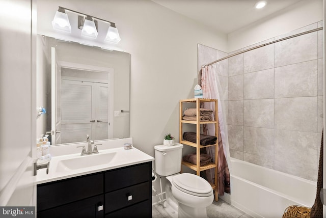 full bathroom with vanity, shower / bath combination with curtain, and toilet