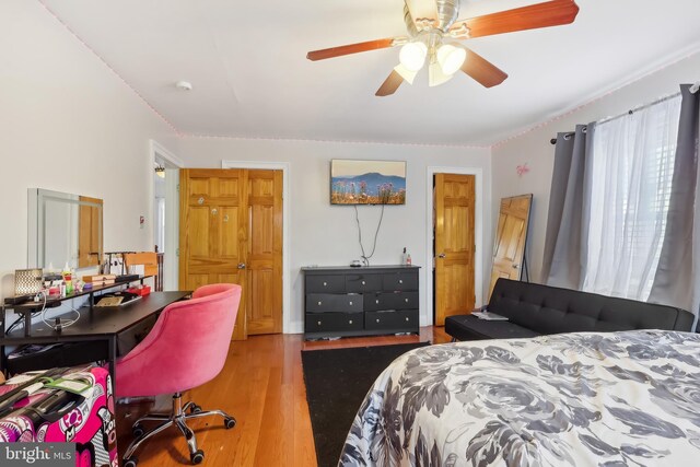 bedroom featuring ceiling fan and wood finished floors