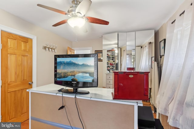 interior space featuring ceiling fan