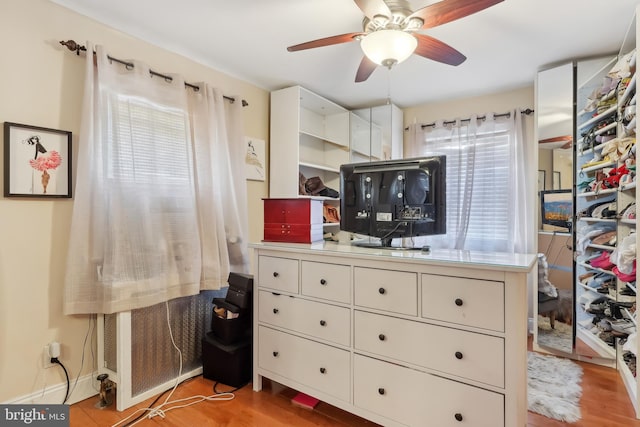 interior space with a ceiling fan