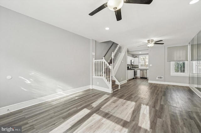 unfurnished living room featuring hardwood / wood-style flooring and ceiling fan