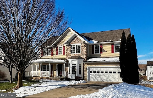 view of front of house with a garage and covered porch