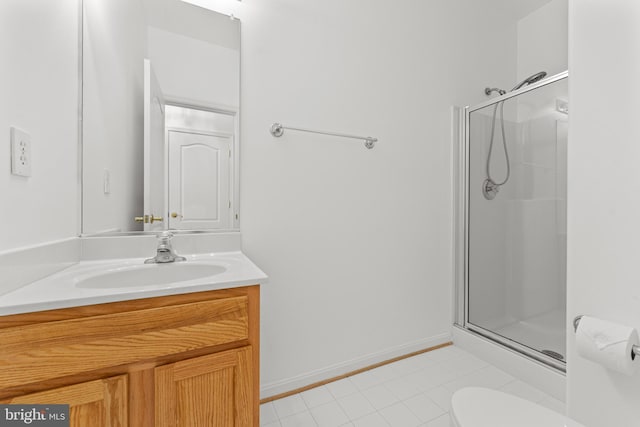 bathroom featuring vanity, toilet, and walk in shower