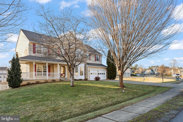 view of front of property with a garage, a front yard, and a porch