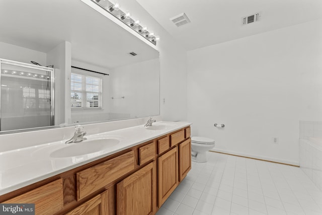 full bathroom with tile patterned flooring, vanity, plus walk in shower, and toilet