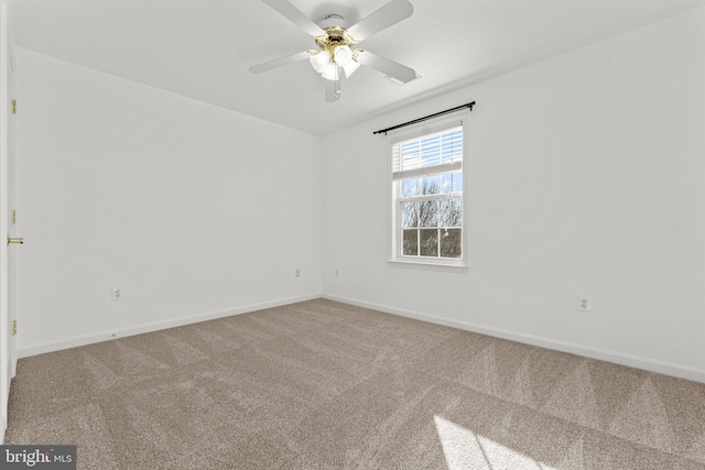 empty room featuring ceiling fan and carpet flooring