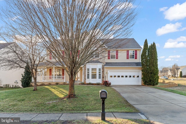 view of front of home featuring a garage, a front lawn, and covered porch