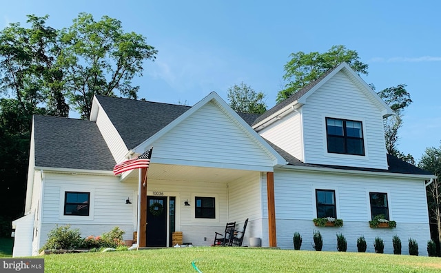 view of front facade with a porch and a front yard