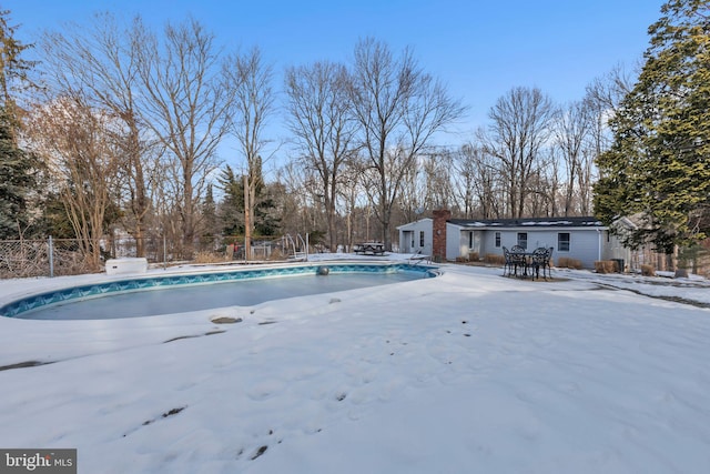 view of snow covered pool