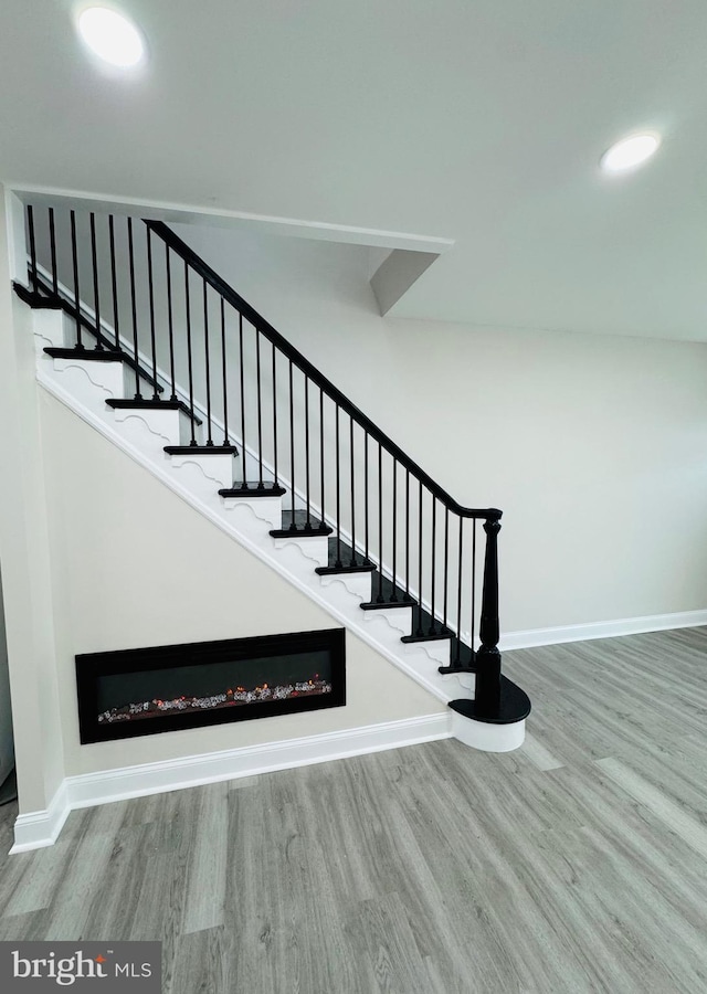 staircase featuring hardwood / wood-style floors