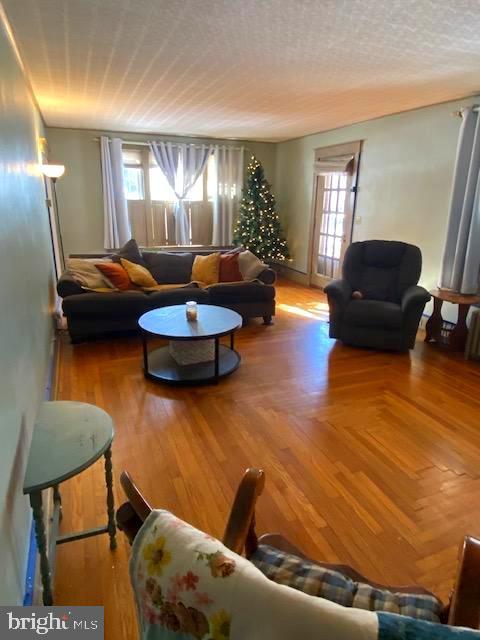 living room with a textured ceiling