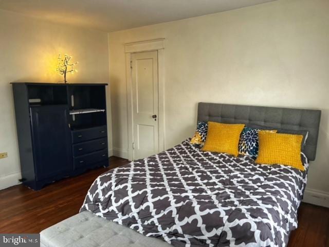 bedroom featuring dark hardwood / wood-style floors