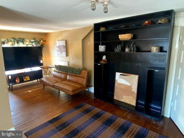 living room with dark wood-type flooring