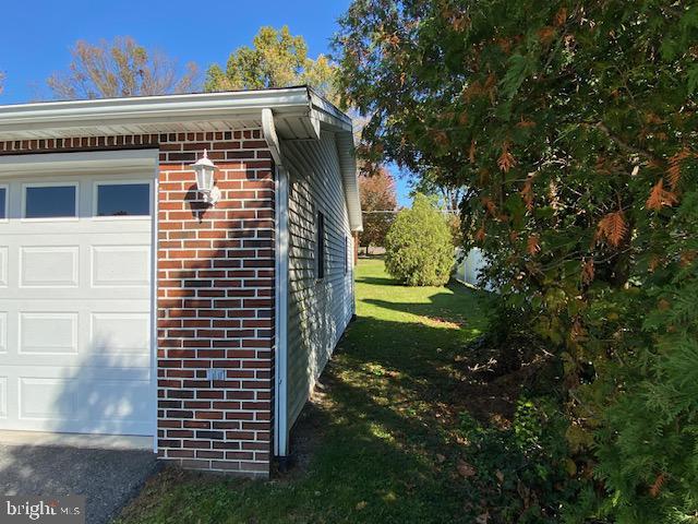 view of side of property with a garage