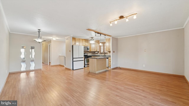 unfurnished living room featuring crown molding, baseboards, light wood finished floors, and track lighting