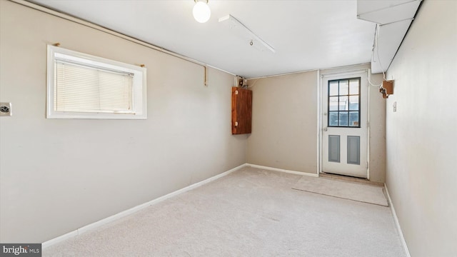 carpeted spare room with baseboards