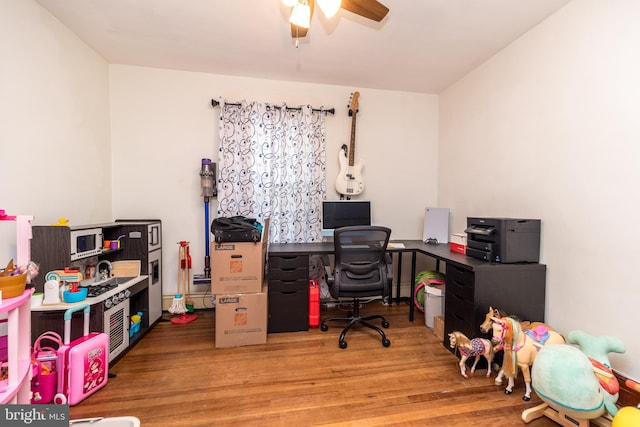 office area featuring ceiling fan and light wood-type flooring