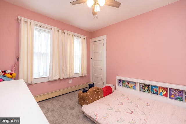 bedroom featuring carpet, a baseboard heating unit, and ceiling fan