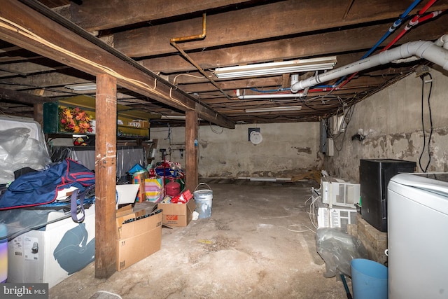 basement with washer / dryer and electric panel