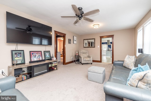 living room with carpet and ceiling fan