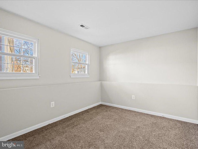 empty room featuring carpet flooring