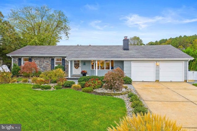 ranch-style home with a garage and a front yard