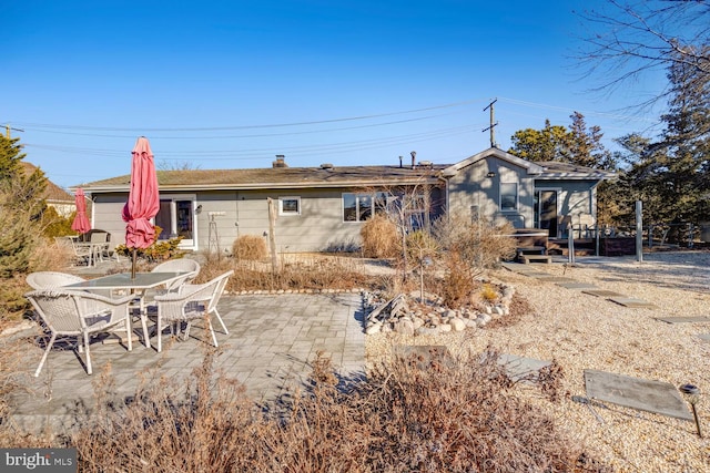 back of property featuring a patio