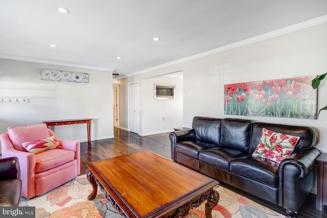 living room featuring ornamental molding and wood-type flooring