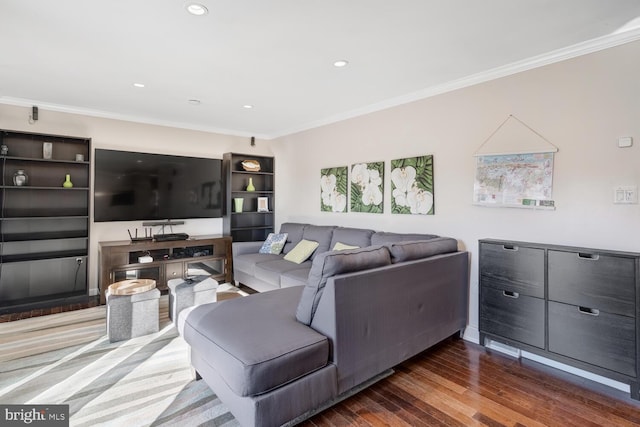 living room with crown molding and dark hardwood / wood-style floors