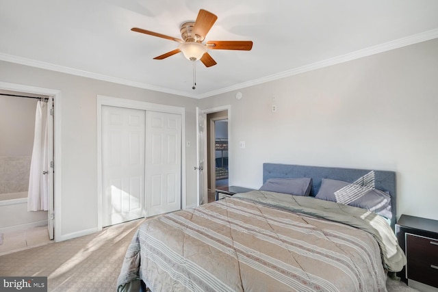 carpeted bedroom with crown molding, ceiling fan, and a closet