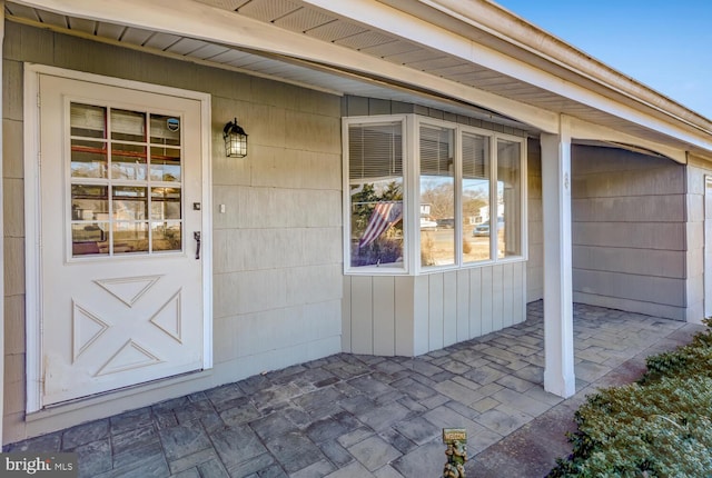 entrance to property featuring a patio area