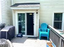 entrance to property featuring a wooden deck