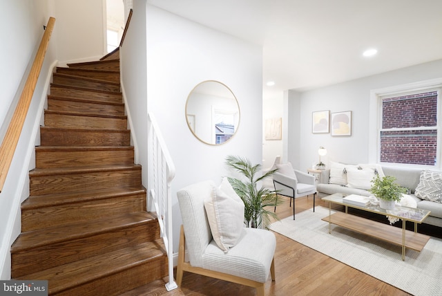 staircase featuring wood-type flooring