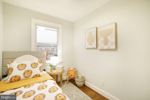 bedroom with hardwood / wood-style floors