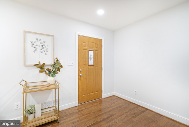 entryway with wood-type flooring