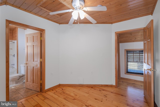 unfurnished room with crown molding, light wood-type flooring, and wooden ceiling