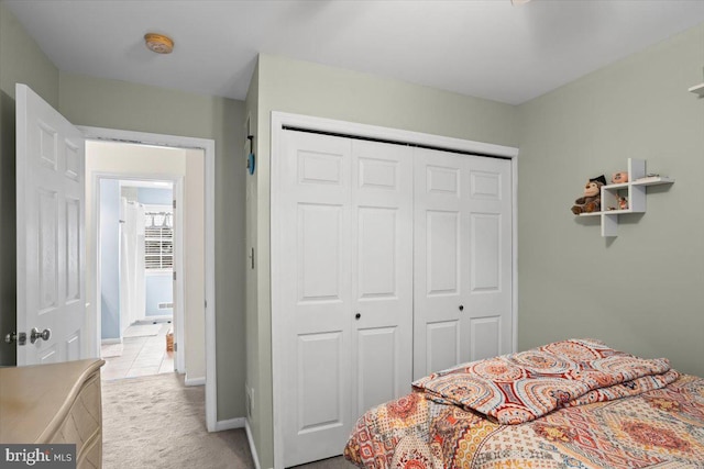 carpeted bedroom with a closet