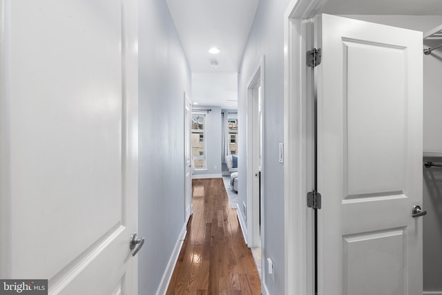 corridor featuring dark wood-type flooring