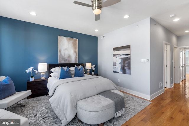 bedroom with wood-type flooring and ceiling fan