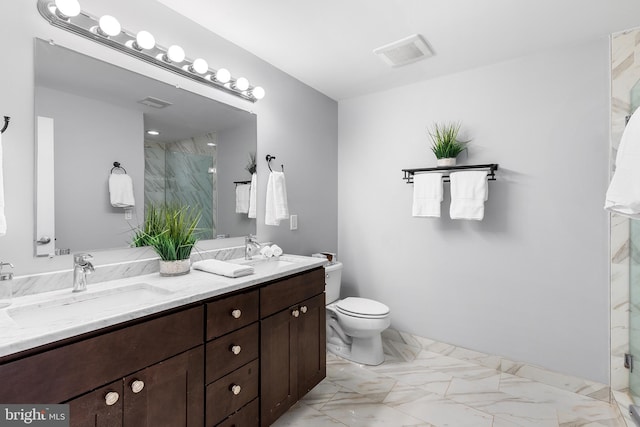 bathroom with vanity, toilet, and an enclosed shower