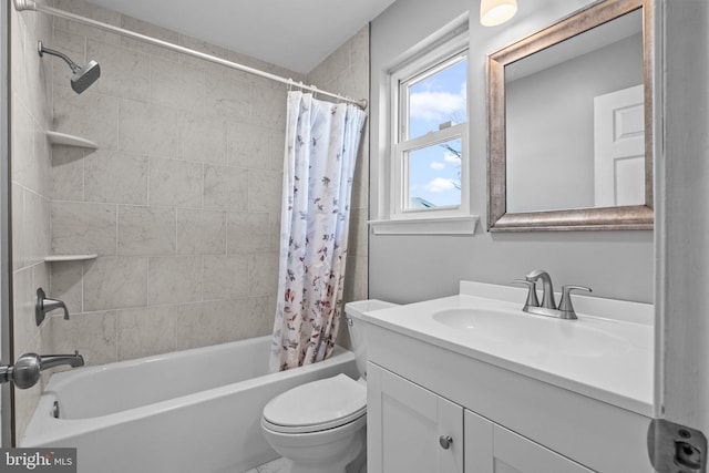 full bathroom featuring shower / tub combo with curtain, vanity, and toilet