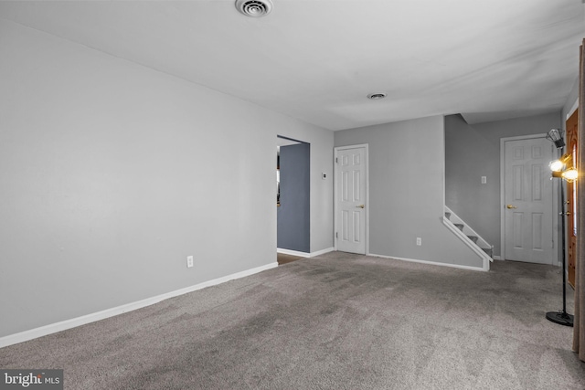 unfurnished room with carpet floors